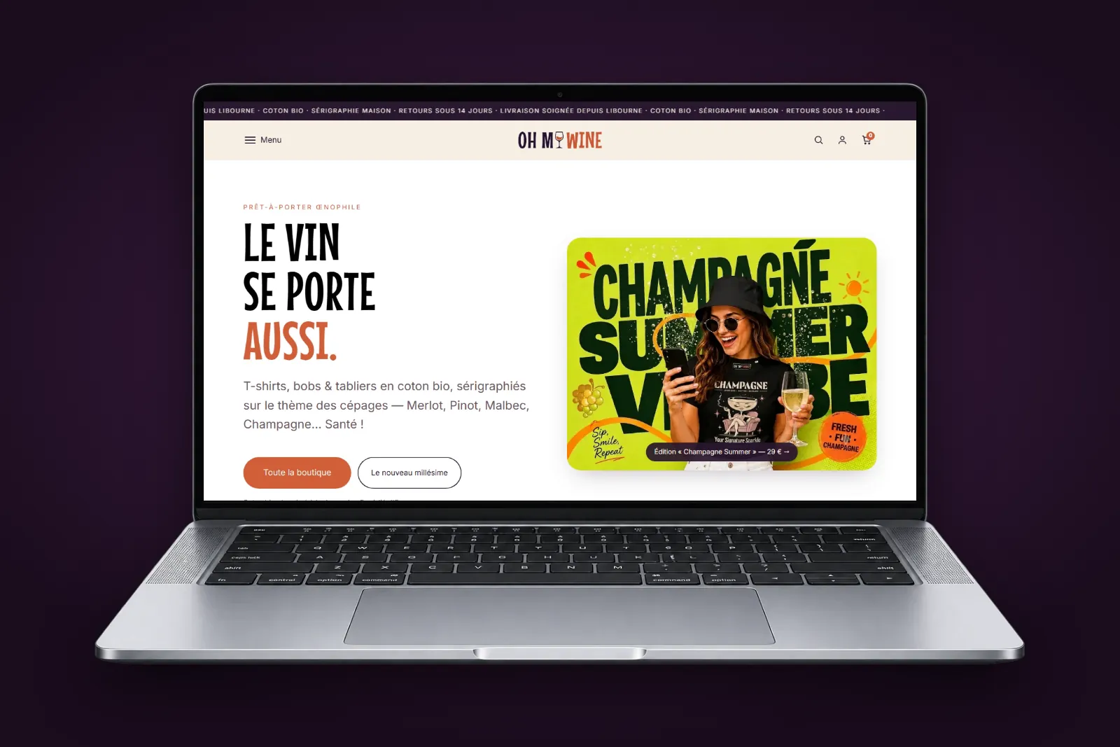 Boutique en ligne Oh My Wine, t-shirts, bobs et tabliers sur le thème du vin, affichée sur un ordinateur portable